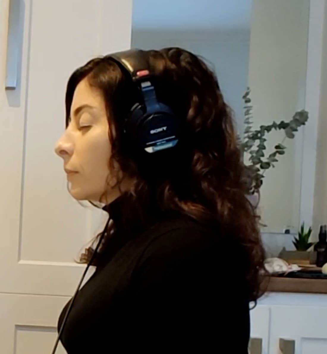 A close view of headphones on, during a virtual sound bath