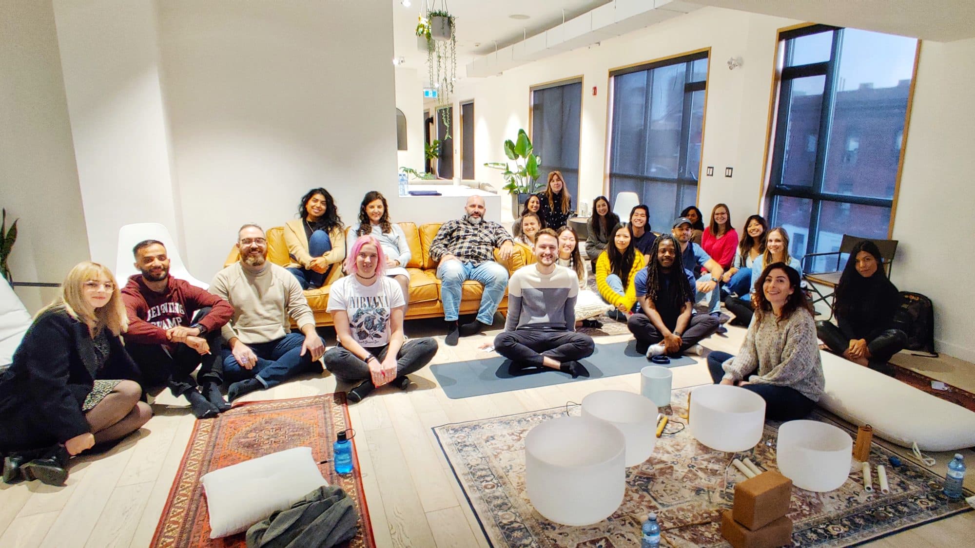 The Wattpad team sitting together around the bowls after a session