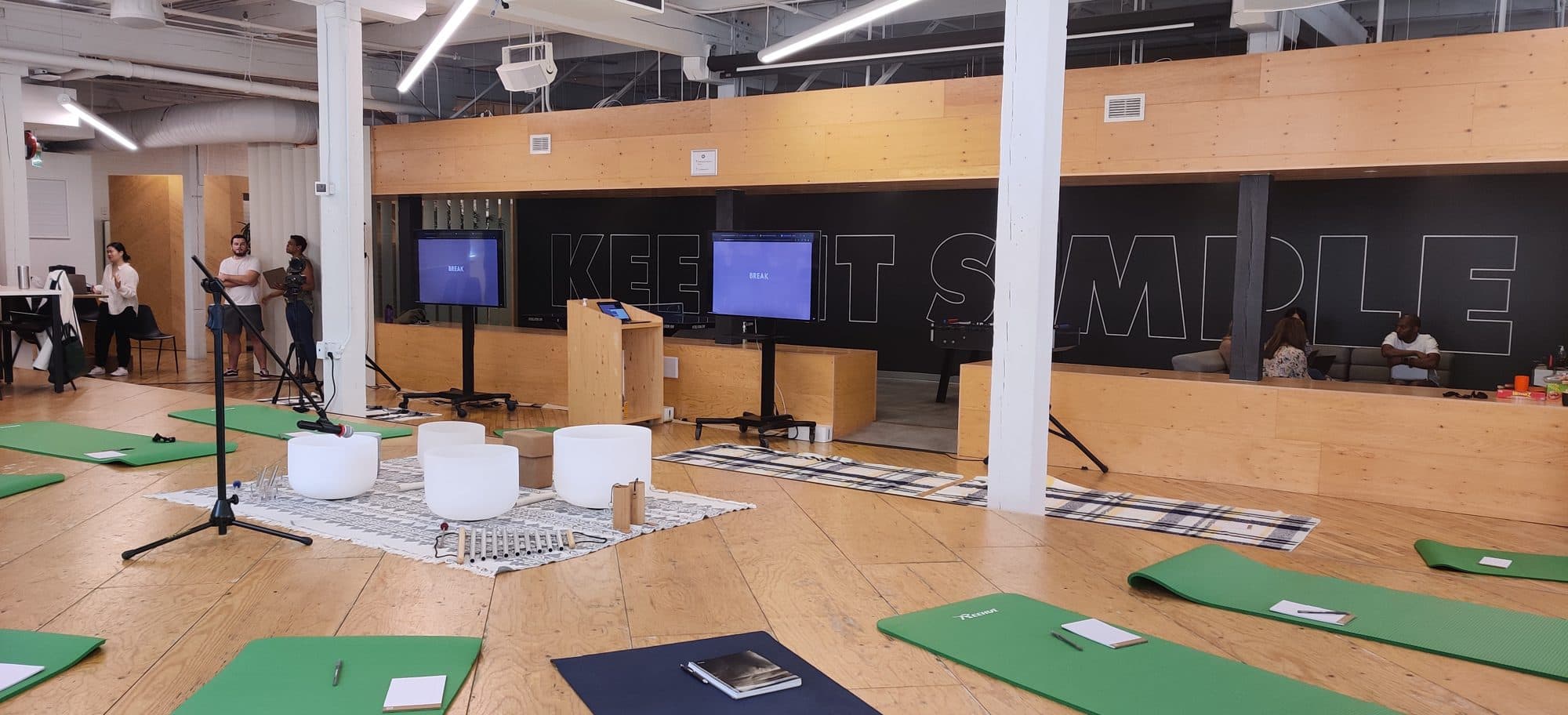 Bowls and mats set up in the Wealthsimple office under their Keep it simple wall