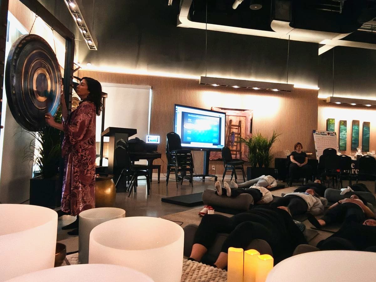A large event space with the room lying down during a session